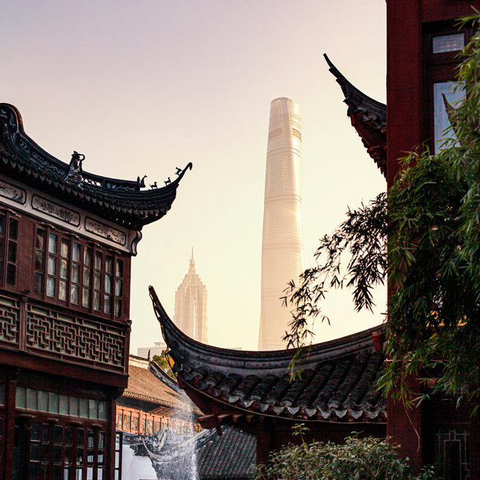 Modern skyscrapers in Shanghaiâ  s Pudong District contrasted with traditional buildings in Yu Garden (è±«å ­)