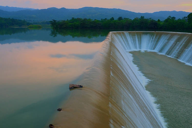 Scenic View Of Dam By Lake Against Sky