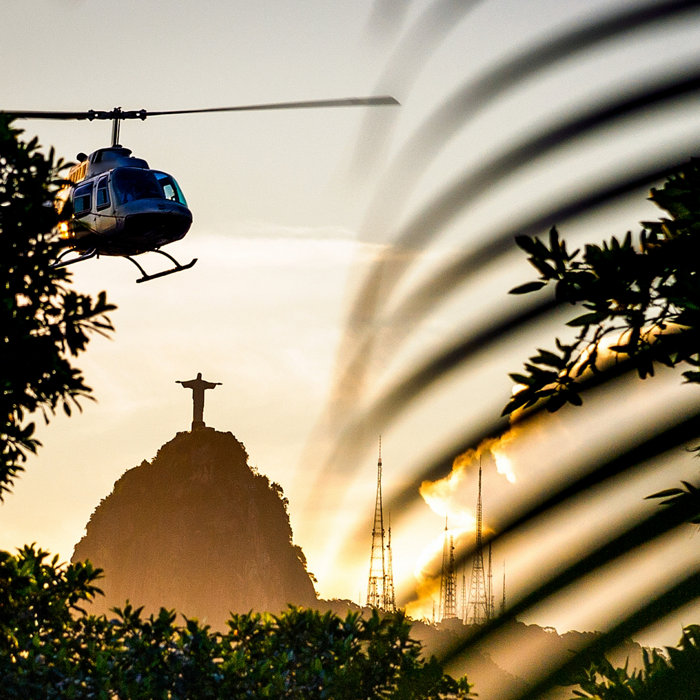 Helicopter flying in the sky with Christ The Redeemer statue in the background, Corcovado, Rio de Janeiro, Brazil