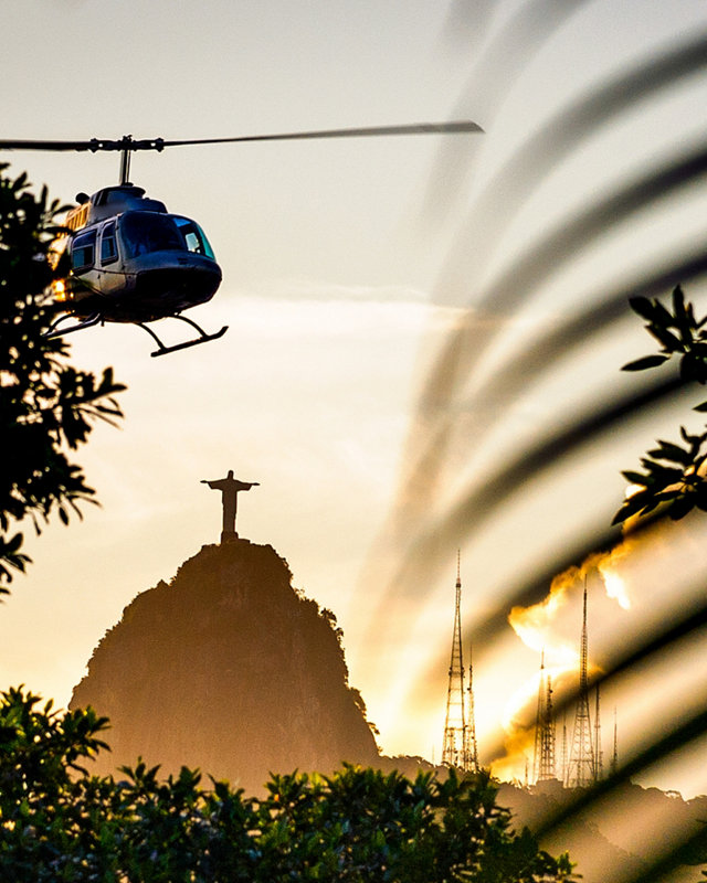 Helicopter flying in the sky with Christ The Redeemer statue in the background, Corcovado, Rio de Janeiro, Brazil