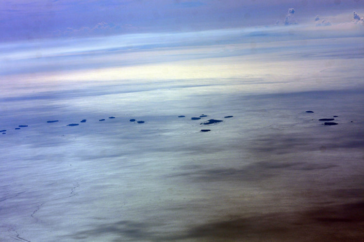 Aerial photo showing the coastal landscape of Banten province, on the north coast of Java Island, Indonesia.  Here are a few of the Thousand Islands (Pulau Seribu) which lie off the north coast of West Java.