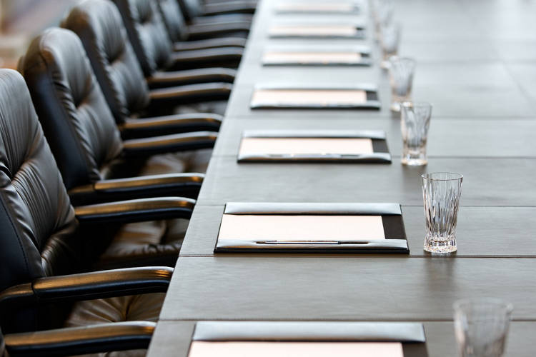 The boardroom table is set for the Annual General Meeting