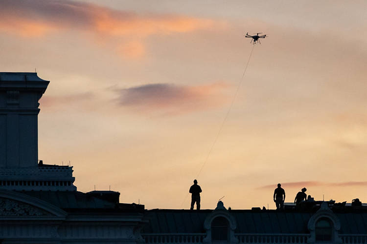 Secret Service agents operate a drone on top of the Executive Office Building while President Joe Biden and First Lady Dr. Jill Biden host an Independence Day celebration at the White House for active-duty military, veterans, and their families in Washington, DC, July 4, 2023. (Photo by Allison Bailey / Middle East Images / Middle East Images via AFP) (Photo by ALLISON BAILEY/Middle East Images/AFP via Getty Images)