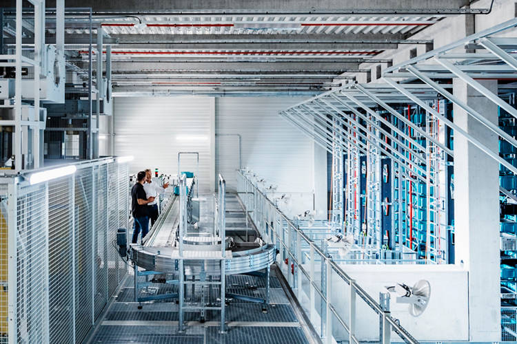 Coworkers working at automated warehouse